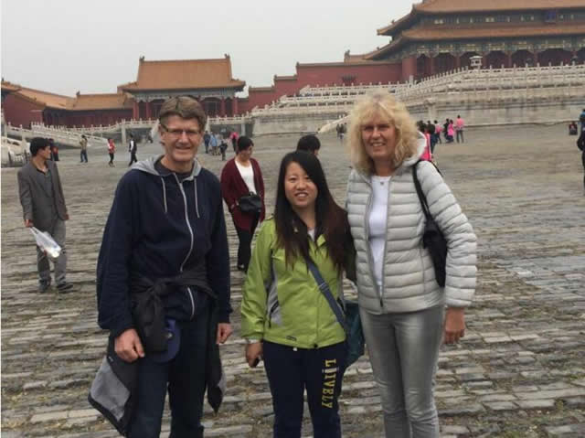 Beijing tour guide Rita and foreign friends at the Palace Museum